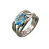 Anello intreccio topazio azzurro sinistra
